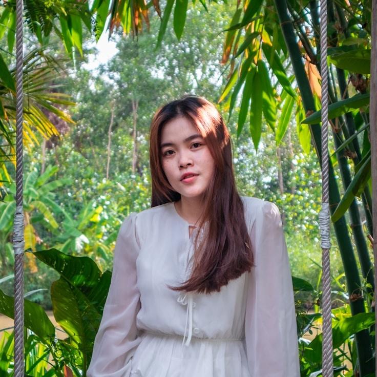 Avery Lane, Lead Design Curator at GladeWillowPhase, reviewing corporate floral arrangements